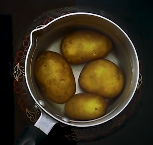 First, keep the temperature of the stove at 350 F and boil the potatoes in a pot with water