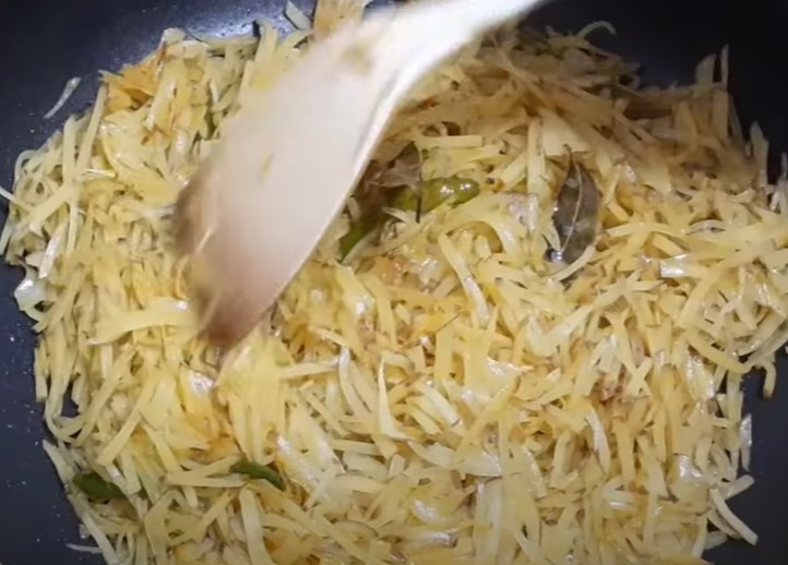 stir the potatoes with a spoon to prevent them from sticking to the pan